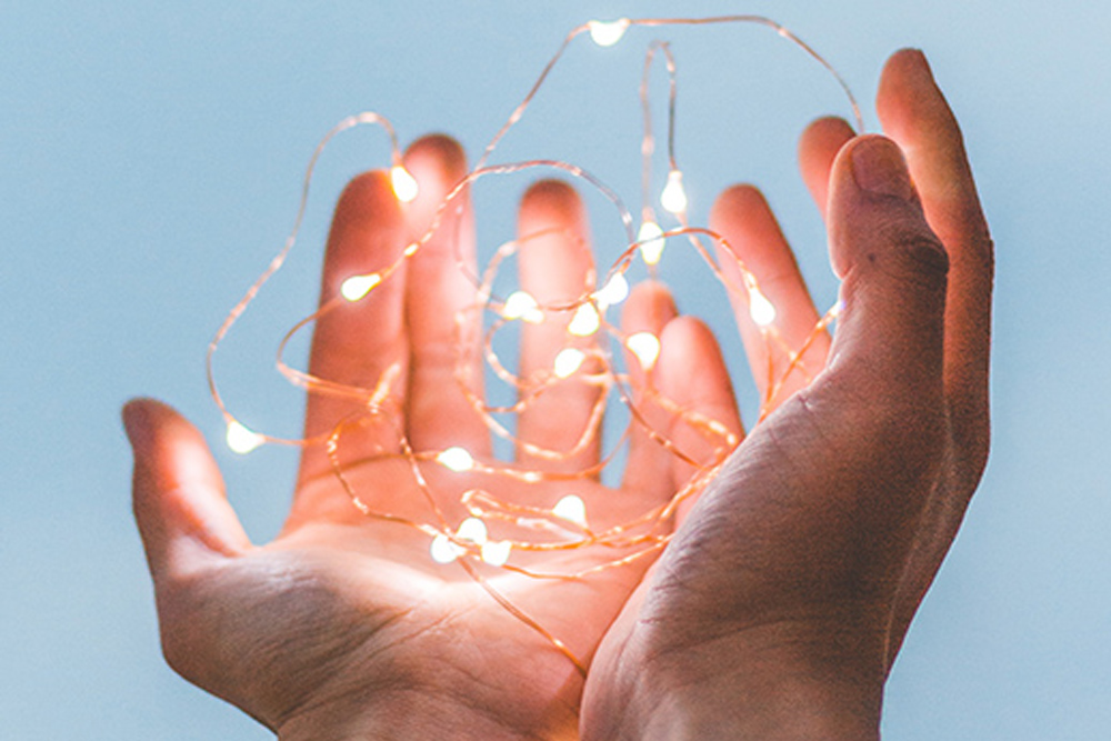 hands holding lights