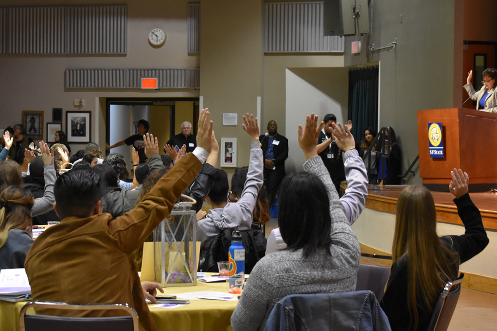 Students Raising Hands for Questions