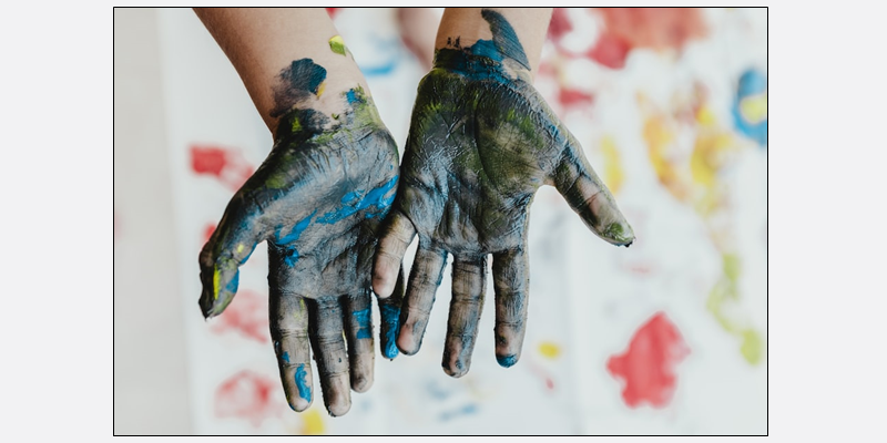 Childs hands with paint