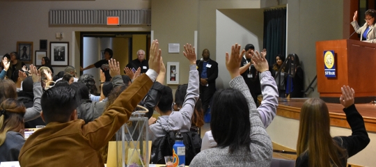 Students Raising Hands for Questions